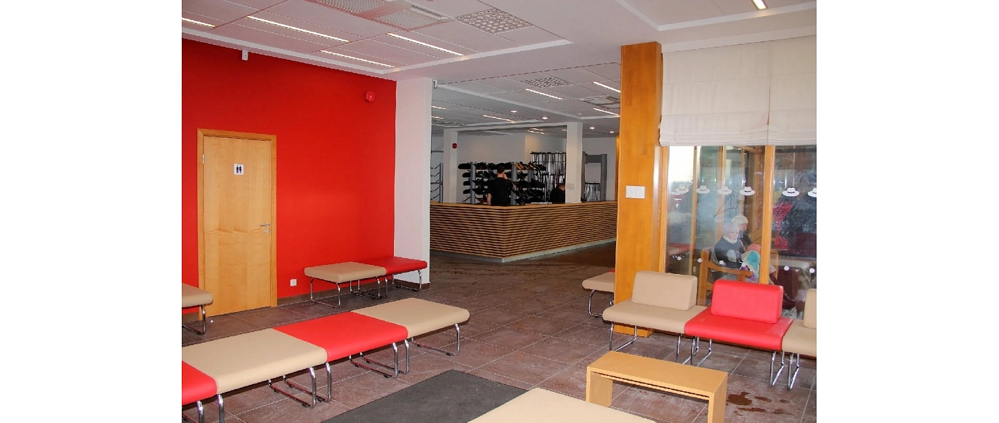 Room with chairs and red and yellow walls