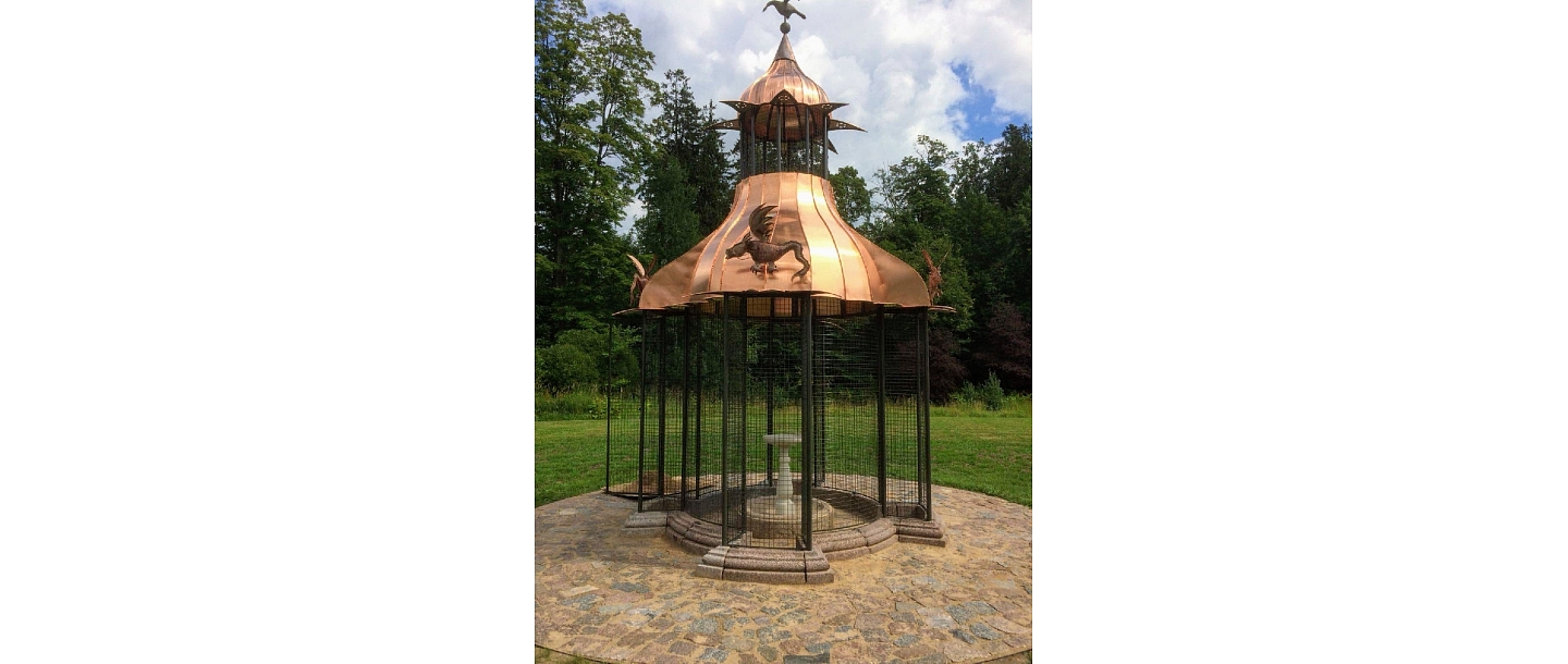 Bird pavilion with a copper roof in the park of Aluksne Castle