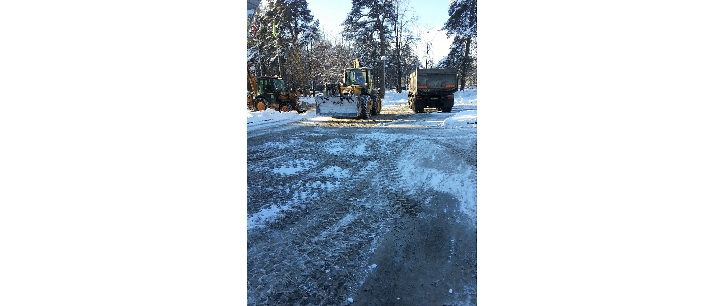 Snow cleaning, clearing sidewalk parking lots from snow.