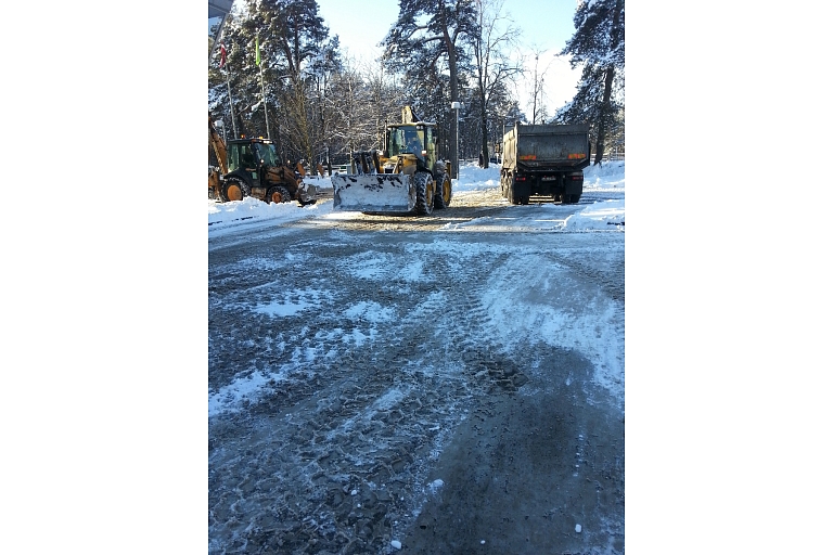 Snow cleaning, clearing sidewalk parking lots from snow.