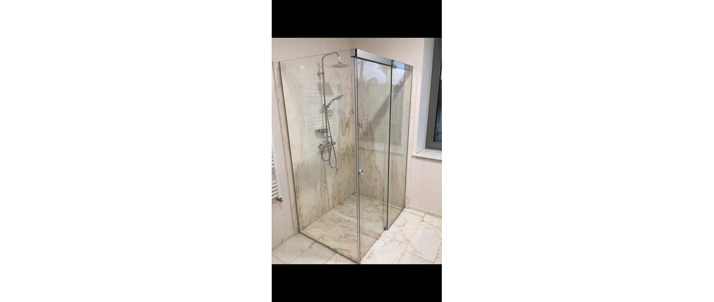 Glazed shower enclosures