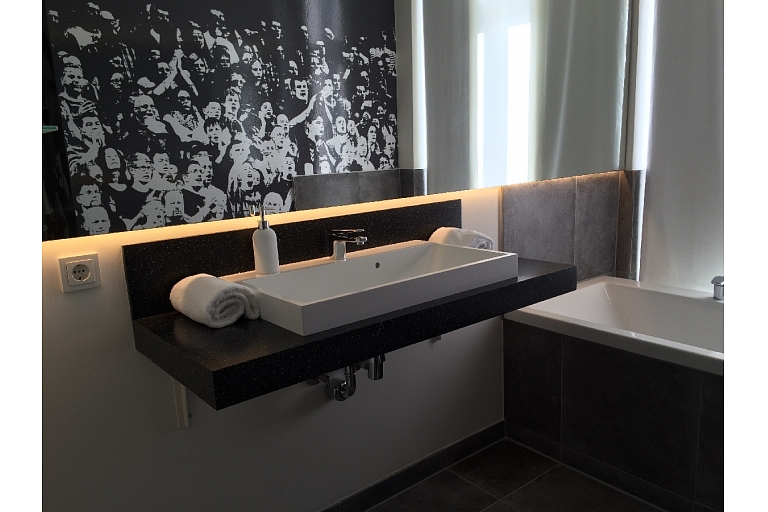 Bathroom surface with sink made of Corian ® and Meganite ® materials