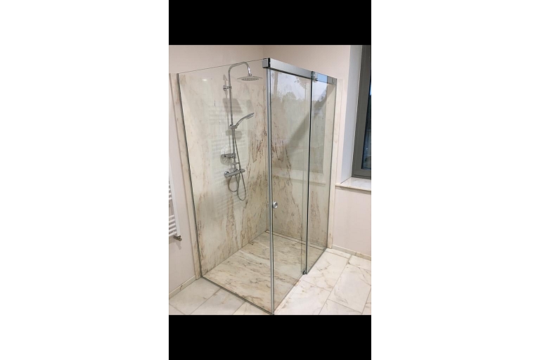 Glazed shower enclosures