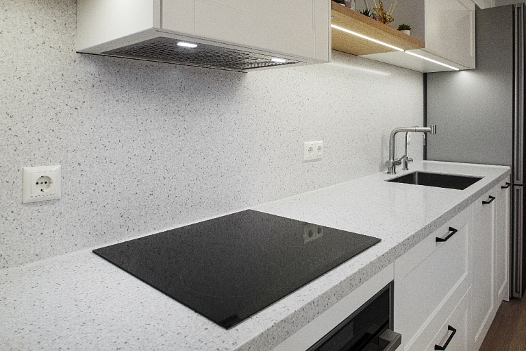 Kitchen surface with a wall panel made of Corian ® material