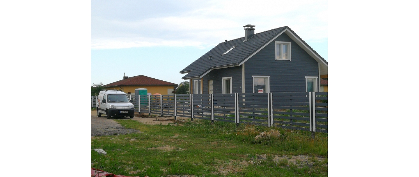 Wooden fence on metal poles