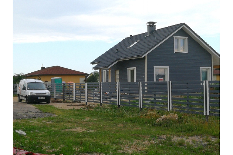 Wooden fence on metal poles
