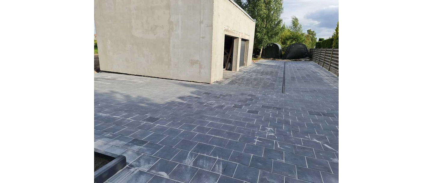 Paved yard next to the garage