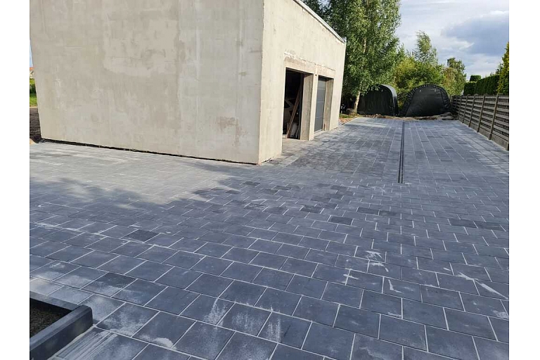 Paved yard next to the garage