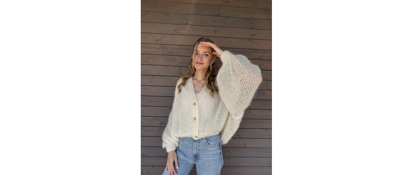 Comfort and elegance in a handmade white sweater.