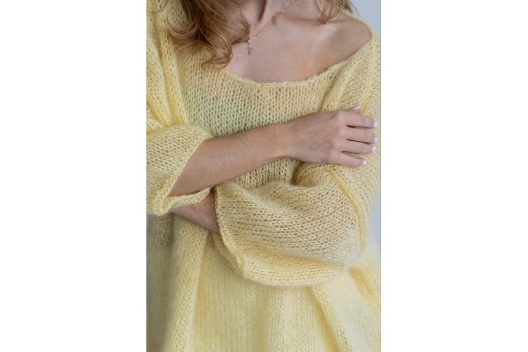 A warm and cozy sweater with a unique style.