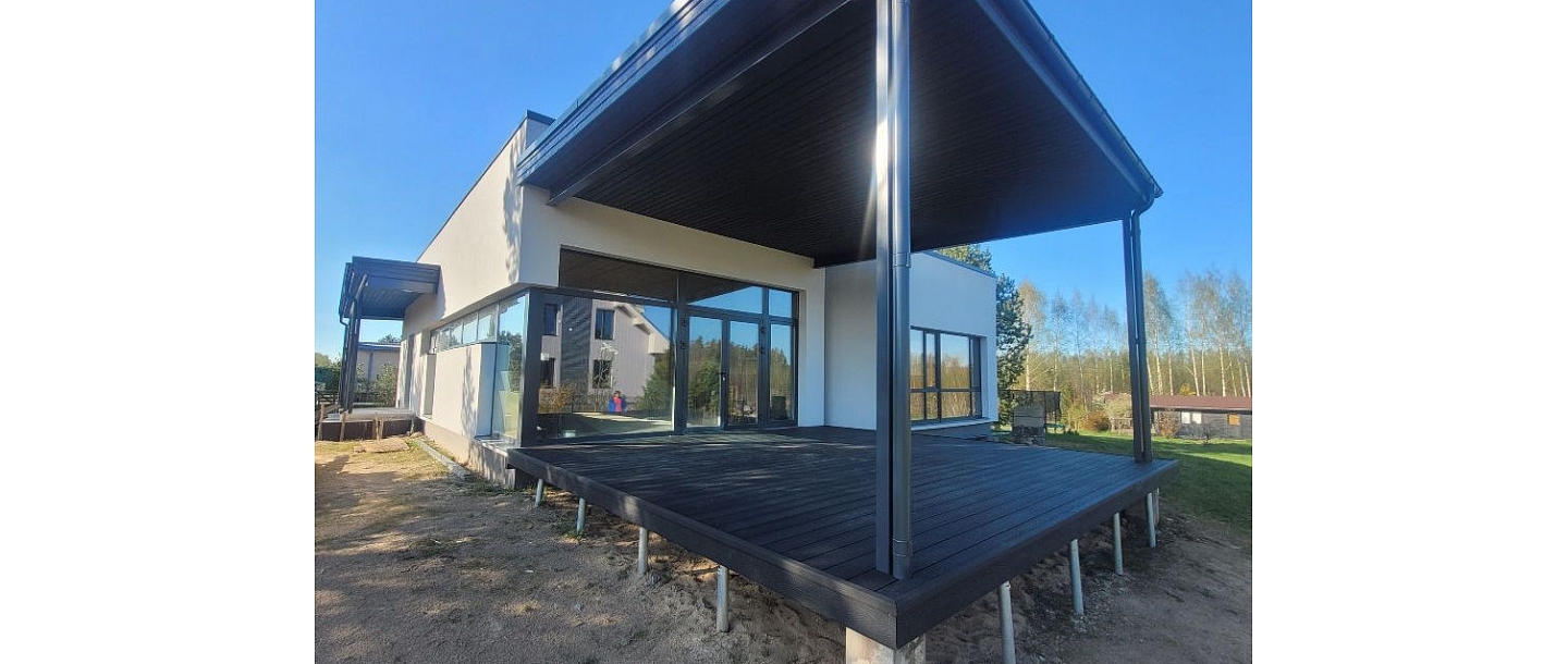Construction of a modern private house with a terrace