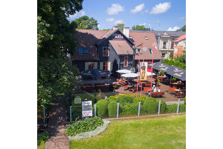 The outdoor terrace of the Postman's House is the perfect place for a leisurely meal in warm weather.