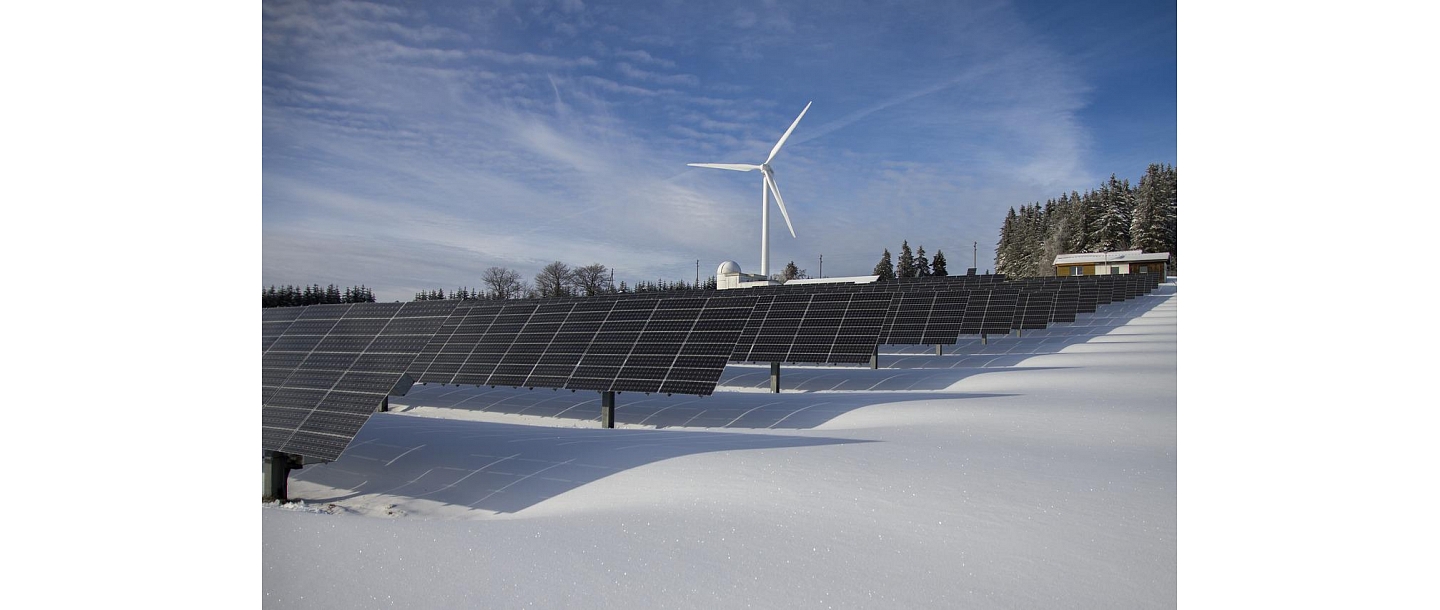 Assembly of solar panels and wind generators