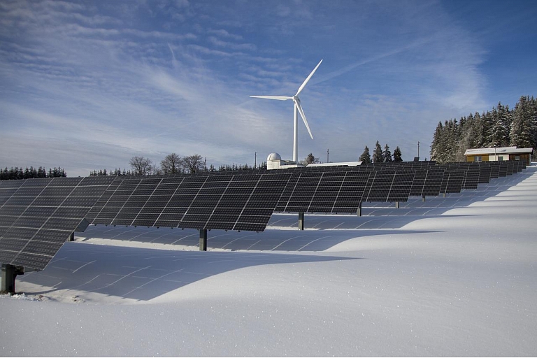 Assembly of solar panels and wind generators