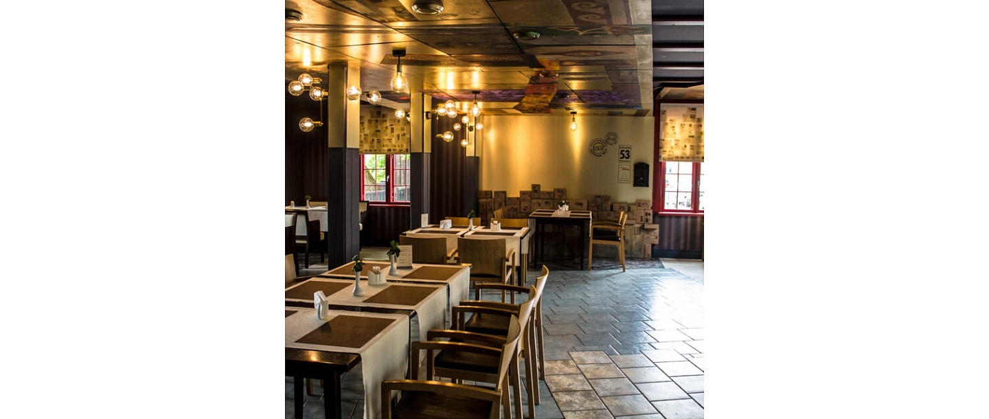 The interior of the Postman&amp;#39;s House restaurant offers a cozy and elegant environment for quiet meals and formal evenings.