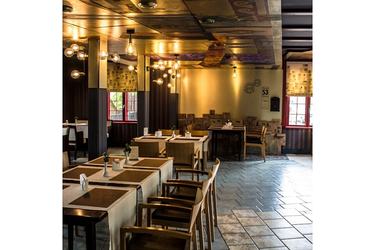 The interior of the Postman's House restaurant offers a cozy and elegant environment for quiet meals and formal evenings.