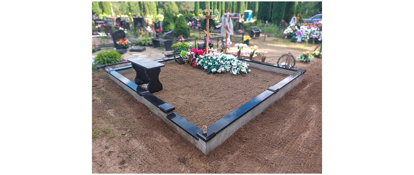 Cemetery with cross and flowers