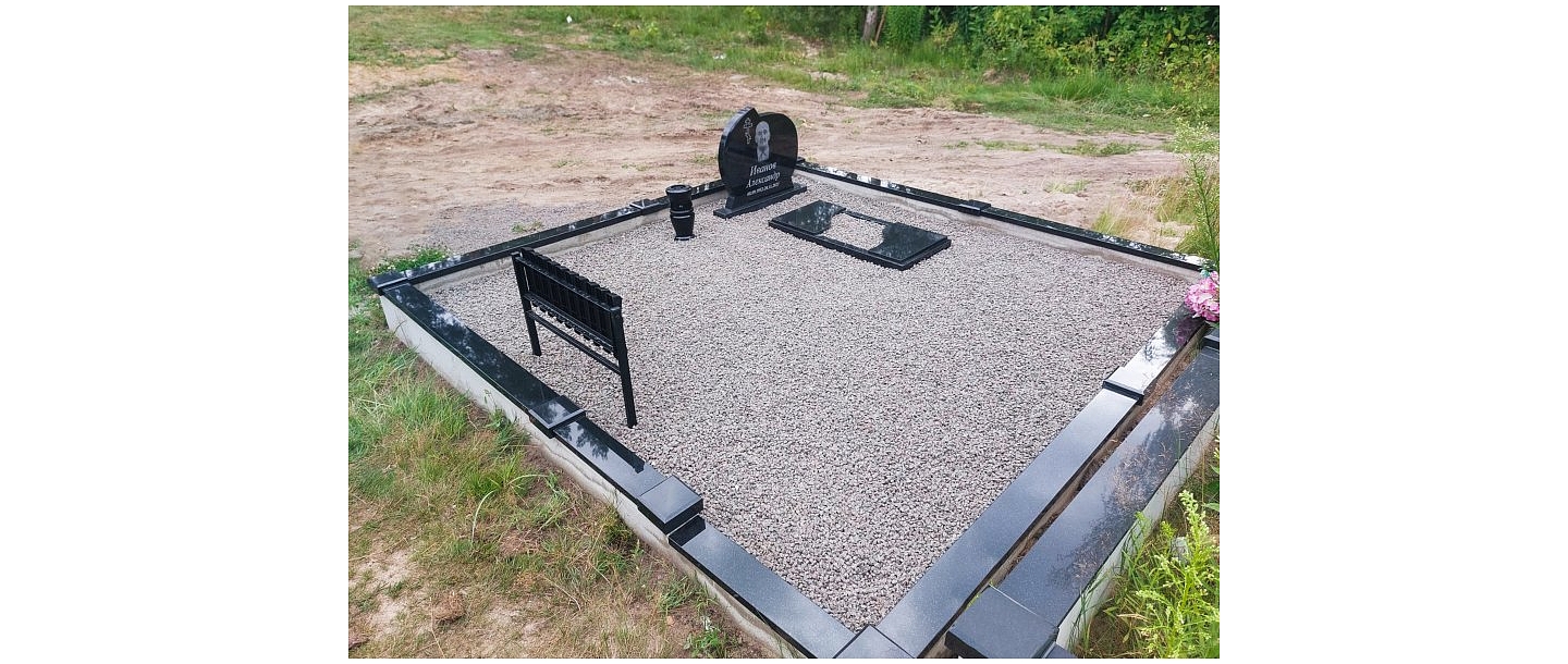 Graveyard with black granite monument
