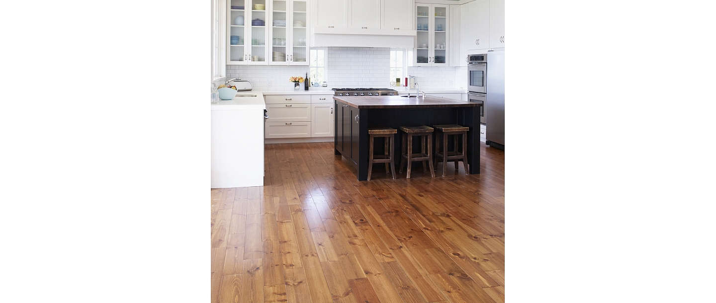 Waxing of wooden floorboards