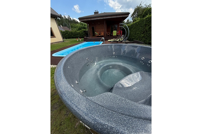 Hot tub with integrated oven and granite top made in Latvia