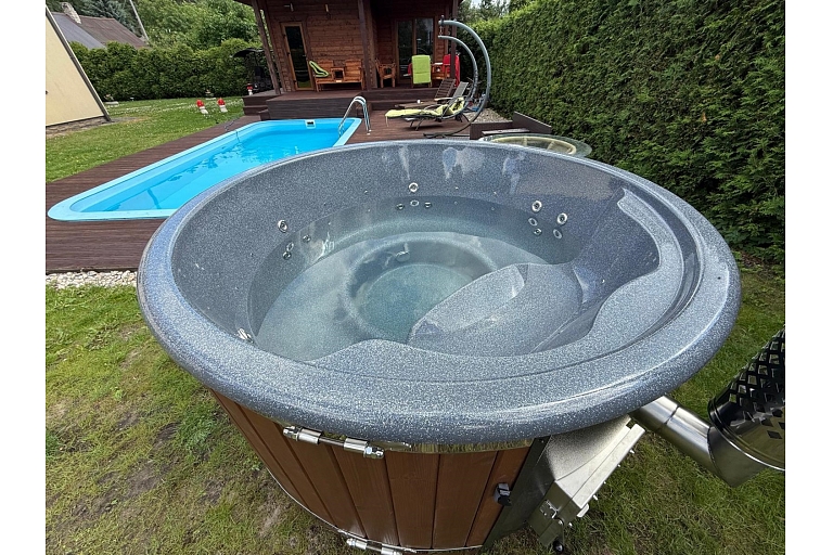 Hot tub with integrated oven and granite top made in Latvia