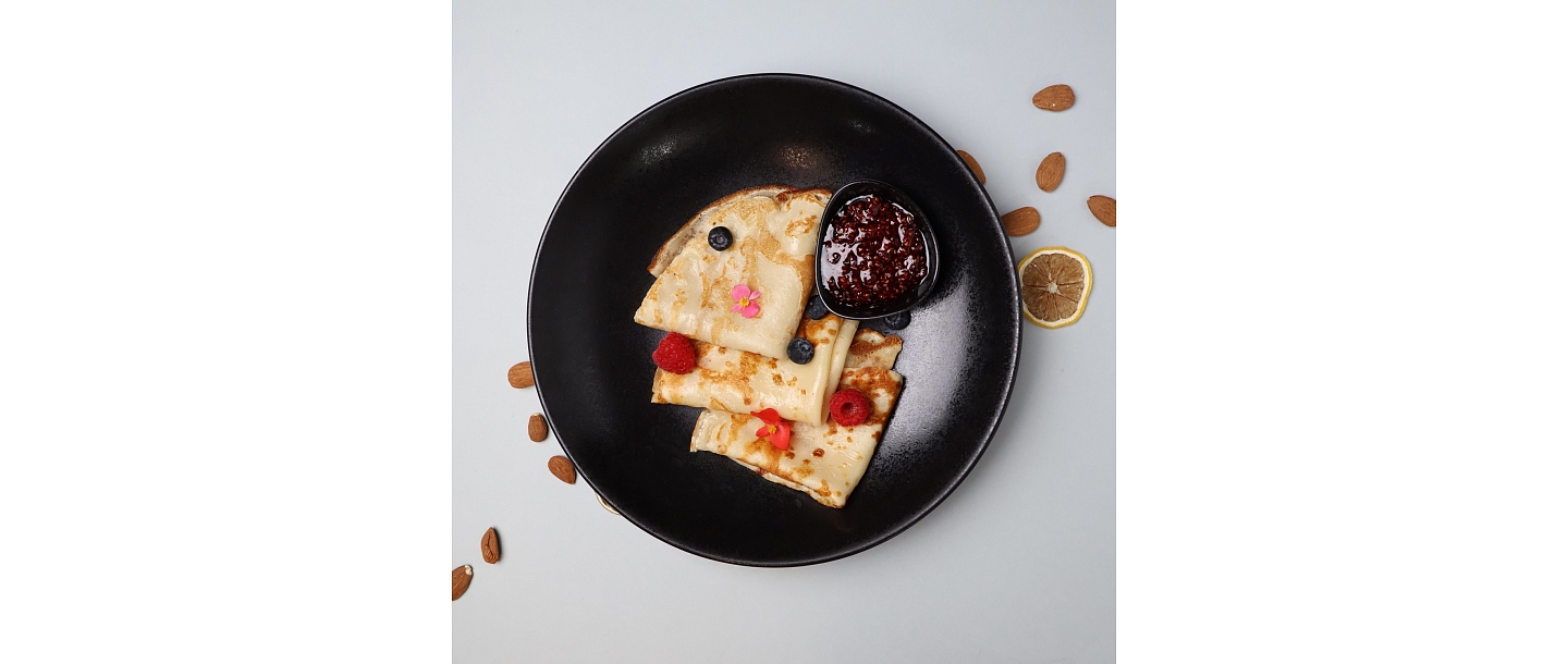 Thin pancakes with jam - the perfect sweet moment