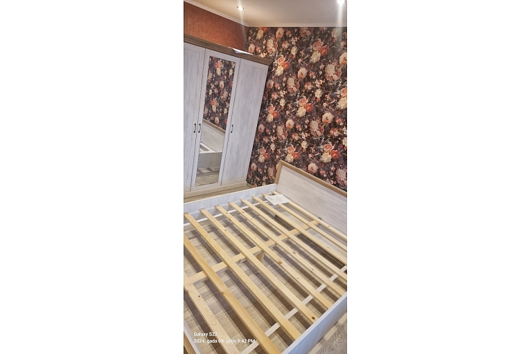 Assembling a bed and wardrobe in the bedroom.