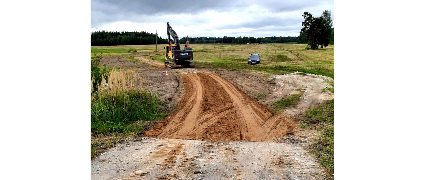 "Valmiera roads" an excavator works at a gravel road construction site in Vidzeme