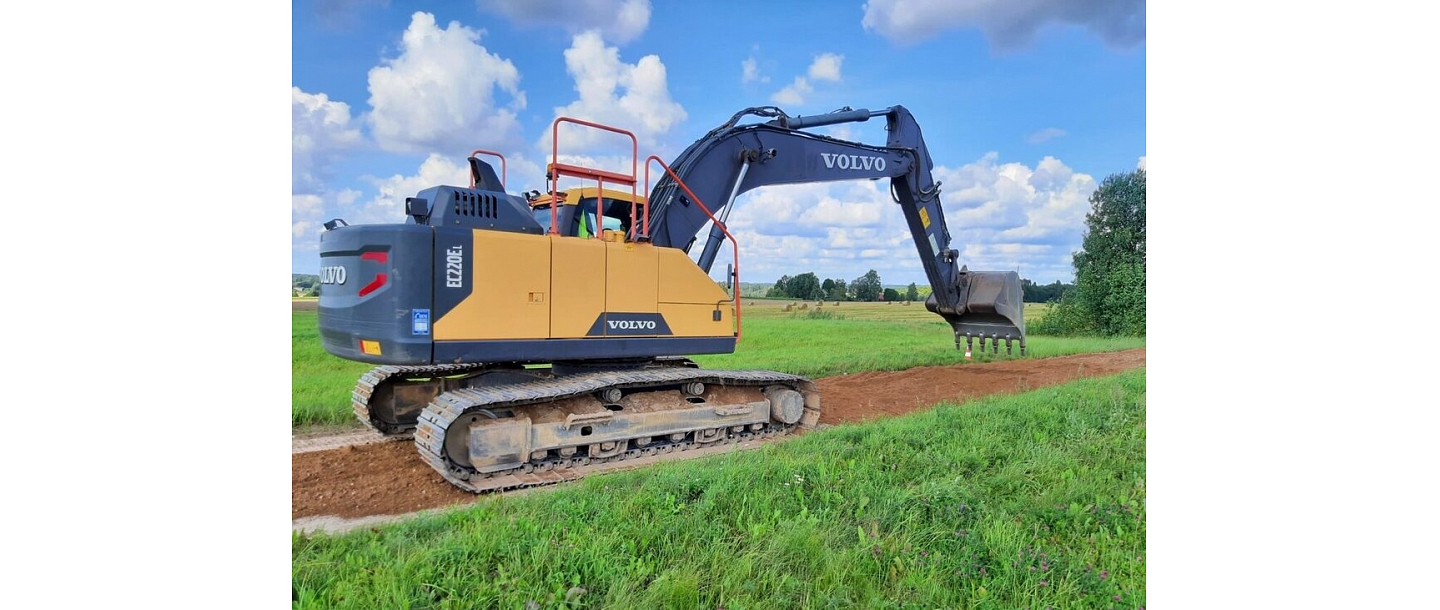 "Valmiera roads" Volvo excavator working on gravel road construction in Vidzeme.