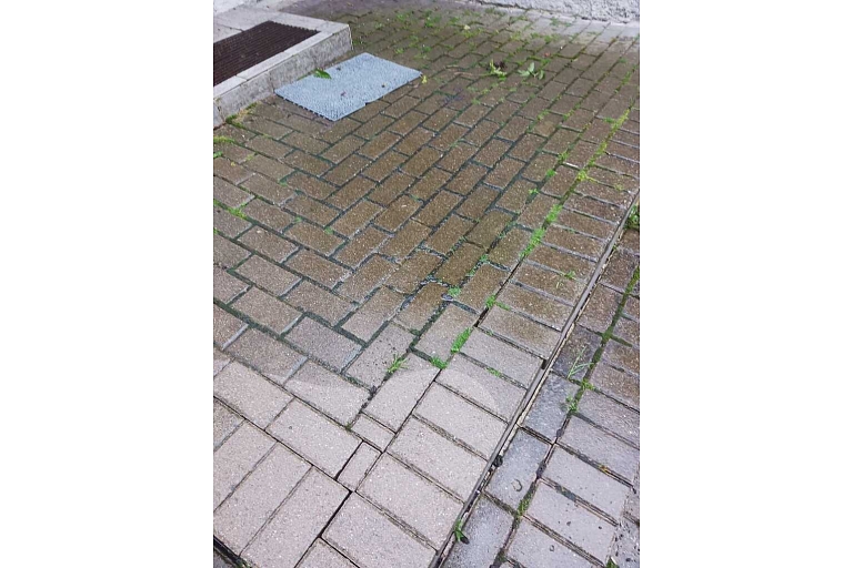 High-pressure washing of pavement