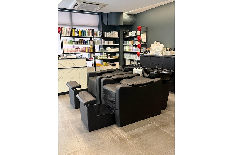 Hair washing area with comfortable chairs.