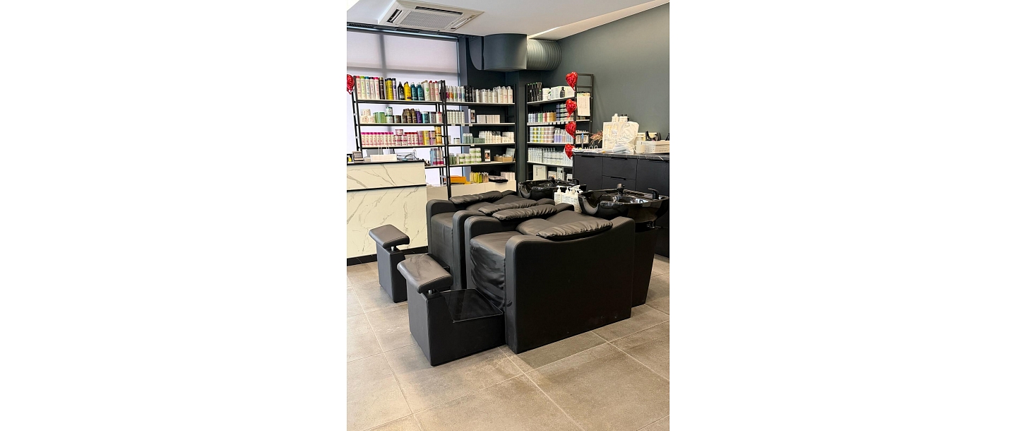 Hair washing area with comfortable chairs.