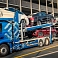 Transportation of cars with an open truck carrier